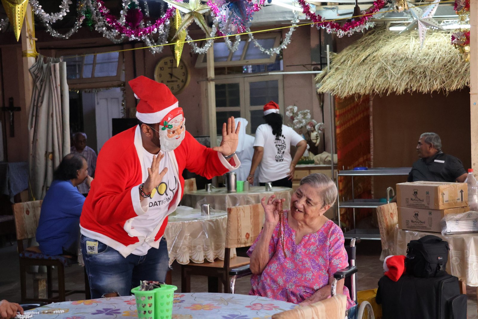 Uday Foundation volunteers spending time with elderly residents
